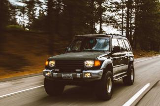 SUV driving down highway.